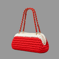 Side view of the red and white crochet handbag